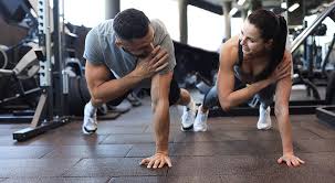 Toning Bingo Wings: Your Ultimate Guide to Sculpting Sleek Arms at the Gym 3 Fitness trainer demonstrating arm toning exercises Northwood